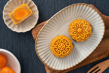 Delicious Cantonese moon cake for Mid-Autumn Festival food mooncake on blue table background.