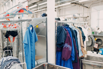 Dry cleaning clothes. Clean cloth chemical process. Laundry industrial dry-cleaning factory