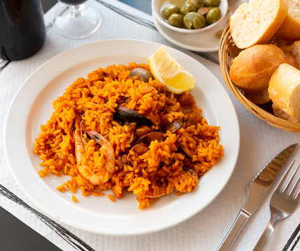 Spainsh dish seafood paella with rice, shrimps and mussels. High quality photo