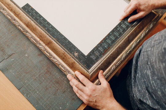Framing Workshop. Measure ruler frame baguette handmade picture frame at studio table