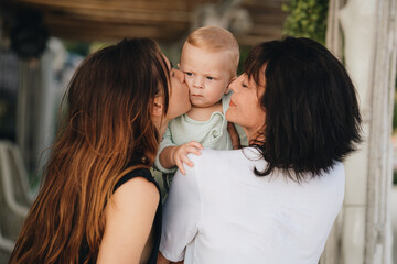 Grandmother with her grandson toddler outdoors