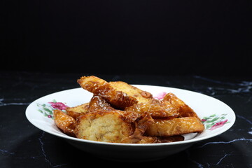 Traditional deep fried turnip cake serving on the plate. Famous ancient appetizer menu in Chinese restaurant. 