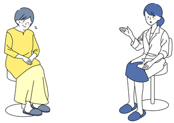 医師の話に落ち込むシニア女性