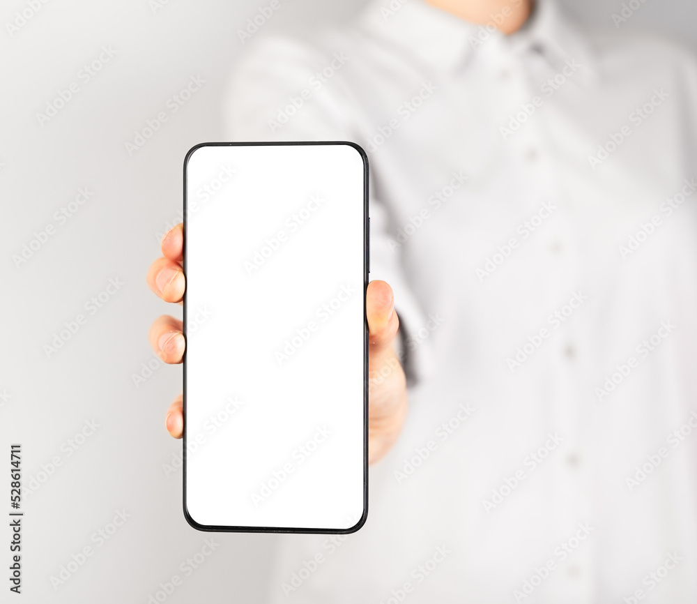 Poster woman holding phone mockup in vertical position. female using smartphone for showing photo or inform