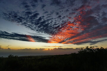 Sunset with orange stripped clouds in Kauai Hawaii