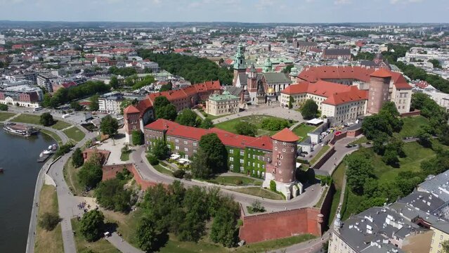 Flyover of the Wawel Royal Castle Cathedral on the Vistula (Wisła) River - Krakow, Poland, a Polish cultural capital, medieval and renaissance architecture, city center - 4K 30FPS Tracking Right