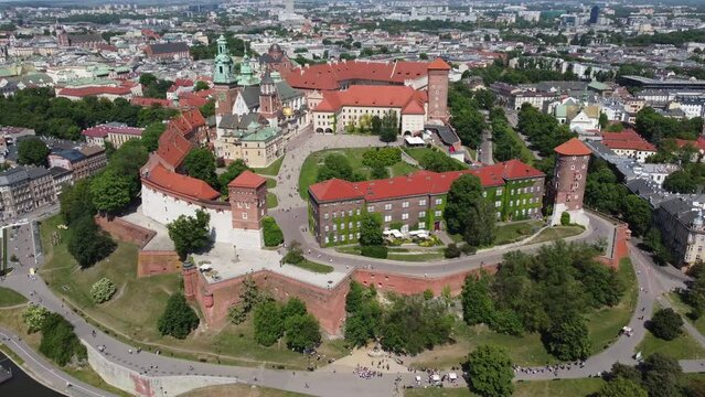 Flyover of the Wawel Royal Castle Cathedral on the Vistula (Wisła) River - Krakow, Poland, a Polish cultural capital, medieval and renaissance architecture, city center - 4K 30FPS Tracking Right