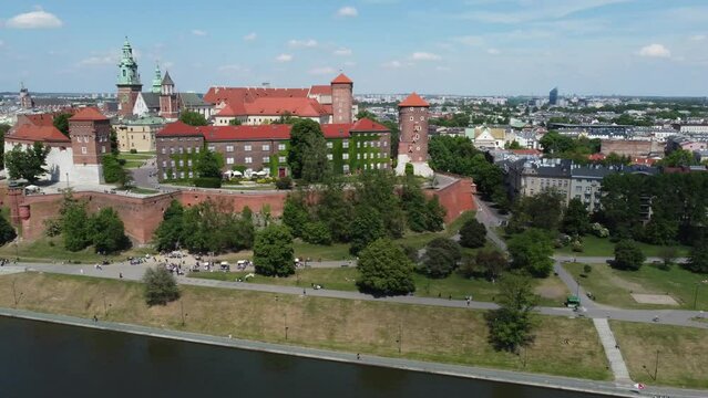 Flyover of the Wawel Royal Castle Cathedral on the Vistula (Wisła) River - Krakow, Poland, a Polish cultural capital, medieval and renaissance architecture, city center - 4K 30FPS Tracking Left