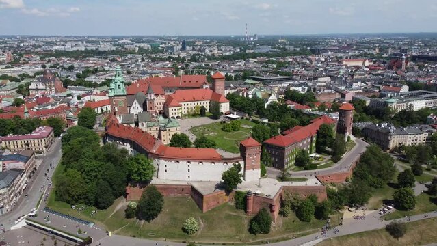 Flyover of the Wawel Royal Castle Cathedral on the Vistula (Wisła) River - Krakow, Poland, a Polish cultural capital, medieval and renaissance architecture, city center - 4K 30FPS Tracking Forward