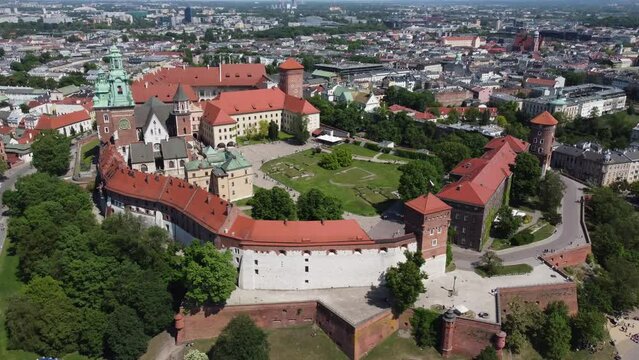 Flyover of the Wawel Royal Castle Cathedral on the Vistula (Wisła) River - Krakow, Poland, a Polish cultural capital, medieval and renaissance architecture, city center - 4K 30FPS Tracking Left