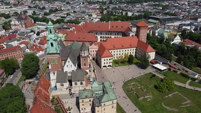 Flyover of the Wawel Royal Castle Cathedral on the Vistula (Wisła) River - Krakow, Poland, a Polish cultural capital, medieval and renaissance architecture, city center - 4K 30FPS Tracking Backwards