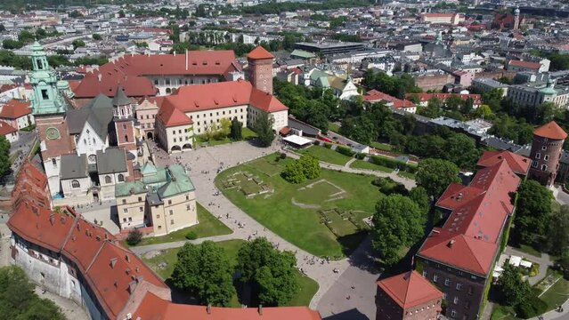 Flyover of the Wawel Royal Castle Cathedral on the Vistula (Wisła) River - Krakow, Poland, a Polish cultural capital, medieval and renaissance architecture, city center - 4K 30FPS Tracking Forward