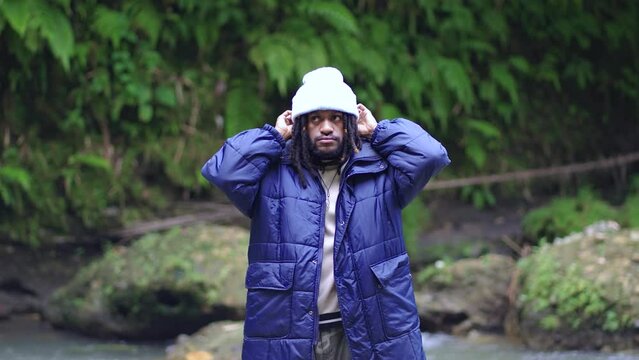 A Black Man Feeling Cold in the Middle of a River