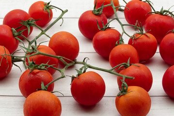 Fresh Cherry tomatoes isolated on clear wooden background. Close-up