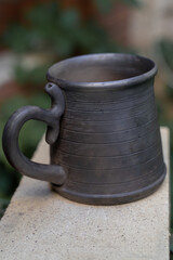 Naklejka premium Ceramics, a ceramic product made with your own hands, made on a potter's wheel, a jug, a mug, clay. 