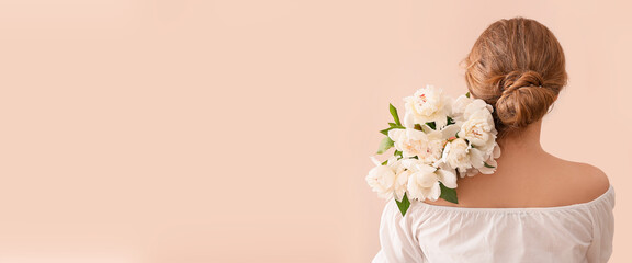 Young woman with bouquet of white peony flowers on beige background with space for text