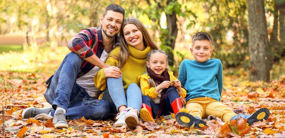 Sticker Happy young family resting in autumn park