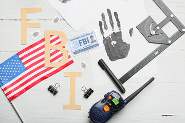 Abbreviation FBI with flag of USA, palm print, identification document of agent and portable radio...