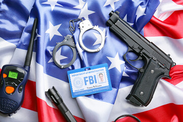 Document of FBI agent with gun, handcuffs, portable radio transmitter and flag of USA