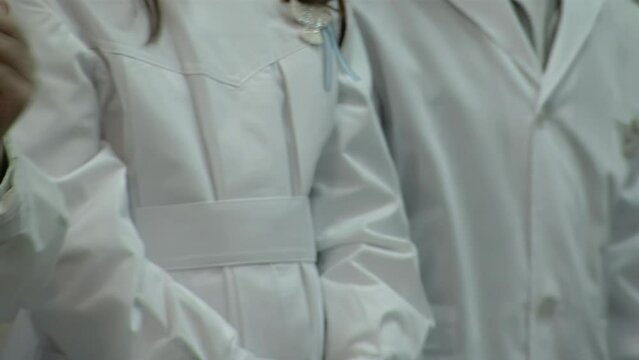 Group of Primary School Children giving an Applause During the Flag Ceremony in a Public School in Argentina. Close Up.