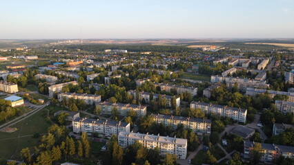 Aerial photography. Top view of a provincial town. Area with multi-storey buildings.