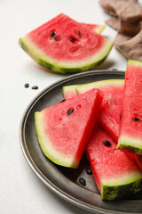 Plate with slices of watermelon on white background, closeup