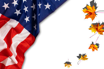 USA flag buried in yellow dry leaves. Autumn texture