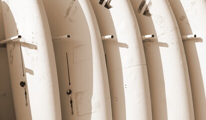 Row of surfboards at the Beach. Surf background. Monochrome Photo. Surfing Wallpaper Background...