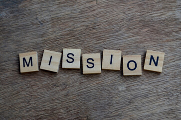 mission text on wooden square, inspiration and motivation quotes