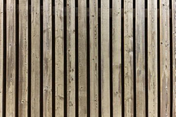 Wooden background from old gray boards close up