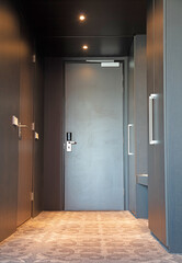 Dark wooden door in the empty hotelroom