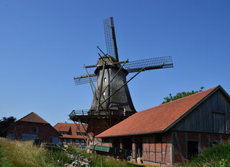 Fototapeta na wymiar Historical Wind Mill at the River Leine, Lower Saxony