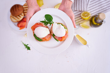 Cream cheese, Smoked salmon and poached egg toasts on a plate