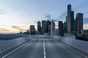 Obraz premium Empty urban asphalt road exterior with city buildings background. New modern highway concrete construction. Concept way to success. Transportation logistic industry fast delivery. Seattle. USA.