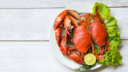 seafood crab cooking food boiled or steamed crab red in the seafood restaurant, fresh crab on white plate background