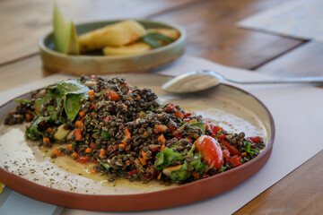 Various Mediterranean dishes served on the restaurant table	