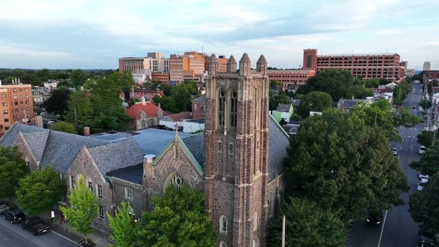 Aerial of Christian church and downtown residential housing in city in USA.