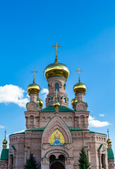 Fototapeta na wymiar Christian church cross in high steeple tower for prayer