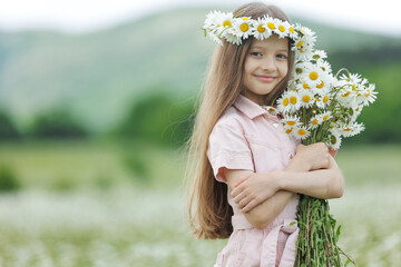 happy girl in the field with flowers. High quality photo
