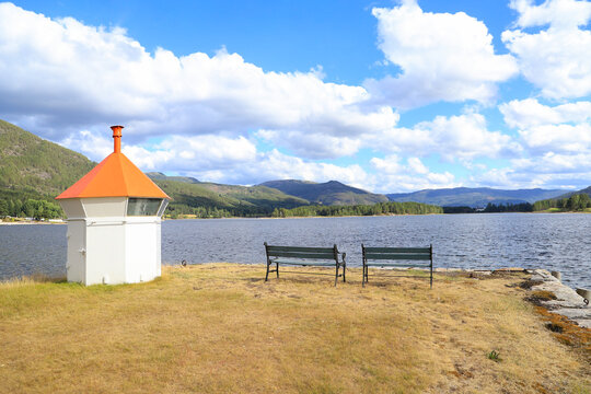 Beautiful view in the bay from Vradal (Vrådal) to the lighthouse an wooden benches, south Norway