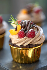 Chocolate cupcakes with fruits. A beautiful dessert. High quality photo