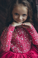 Happy little girl in a beautiful dress. High quality photo