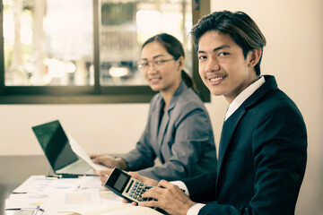 Two business leaders talk about charts, financial graphs showing results are analyzing and calculating planning strategies, business success building processes