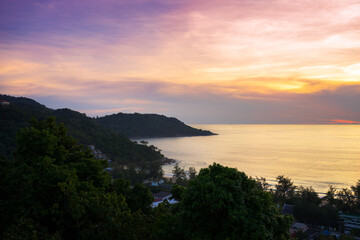 Fototapeta premium Seascape view from the high on sea horizon and coastline at beautiful sunset on Phuket Island in Thailand
