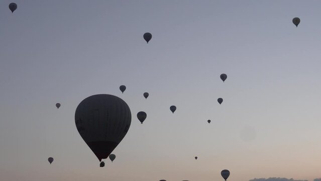 Hot air balloon flight in the morning at dawn in Kapadokia, Turkey.