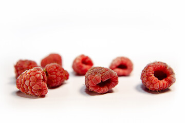 raspberry berries on a white background,  close-up, juicy fresh frozen