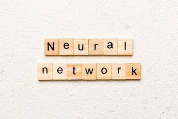 NEURAL NETWORK word written on wood block. NEURAL NETWORK text on cement table for your desing, concept