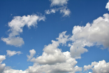 Obraz na płótnie Canvas White, fluffy clouds in blue sky. Background from clouds.