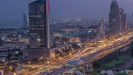 Aerial view of Sheikh Zayed Road in Dubai Internet City area night to day timelapse