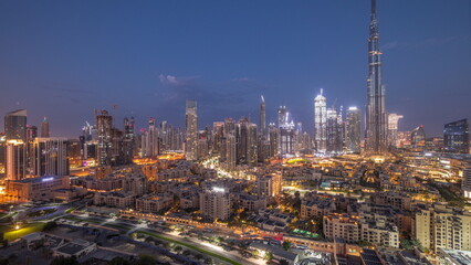 Obraz premium Dubai Downtown night to day timelapse with tallest skyscraper and other towers